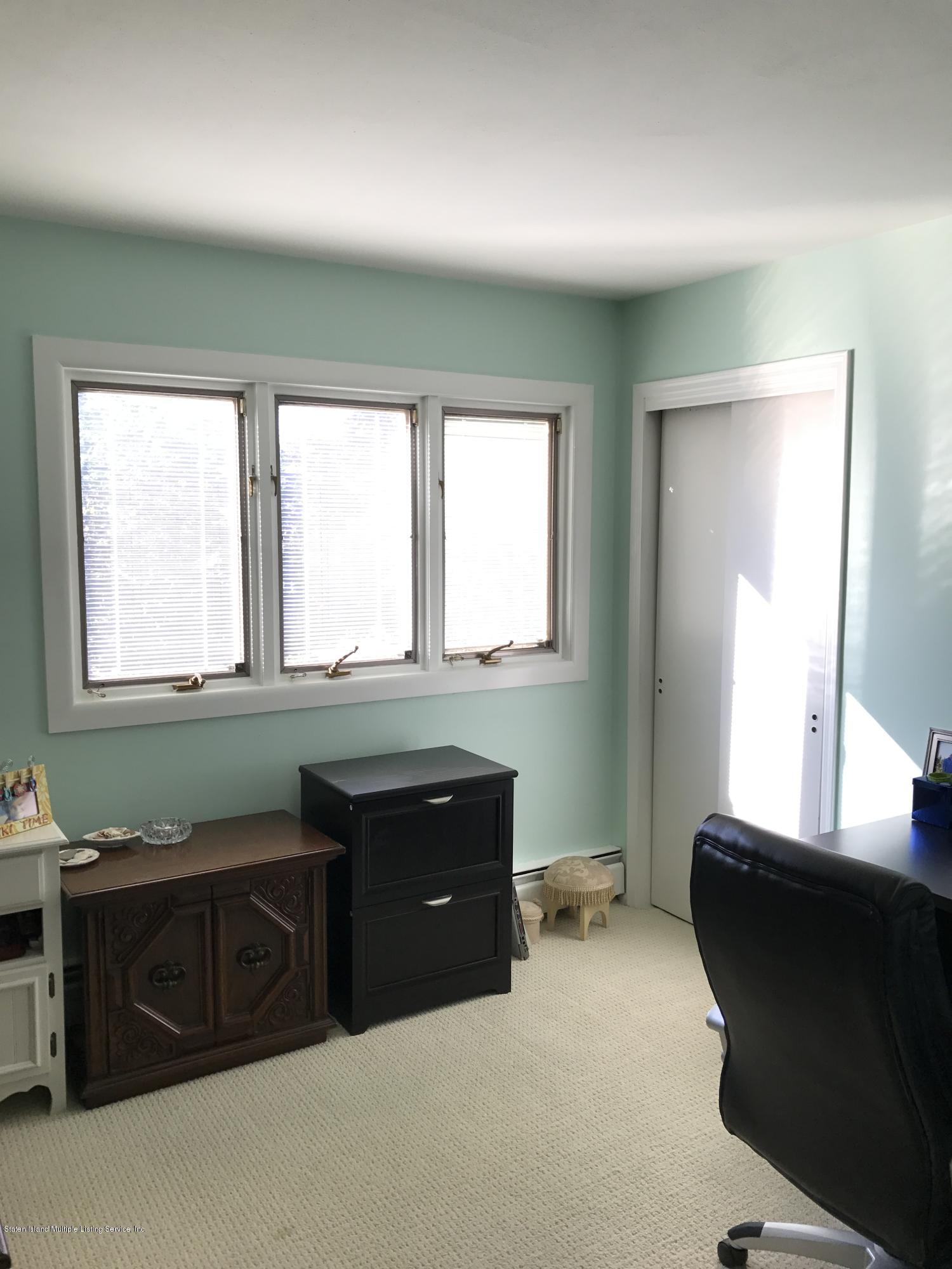 80 Rathbun Avenue Staten Island, NY 10312 - Photo 12 of 21 a bathroom with a sink and a mirror