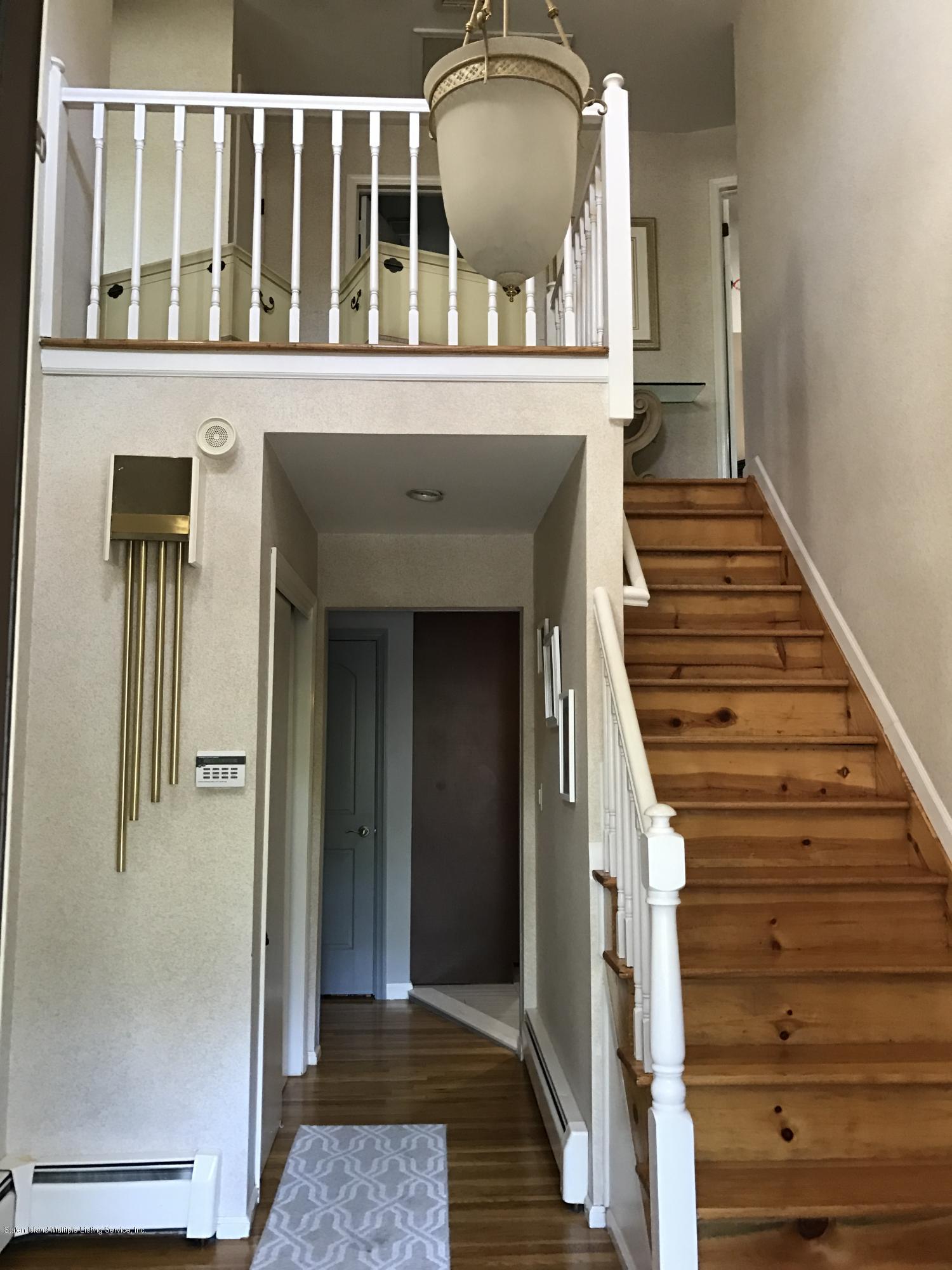 80 Rathbun Avenue Staten Island, NY 10312 - Photo 2 of 21 a view of entryway and hall with wooden floor