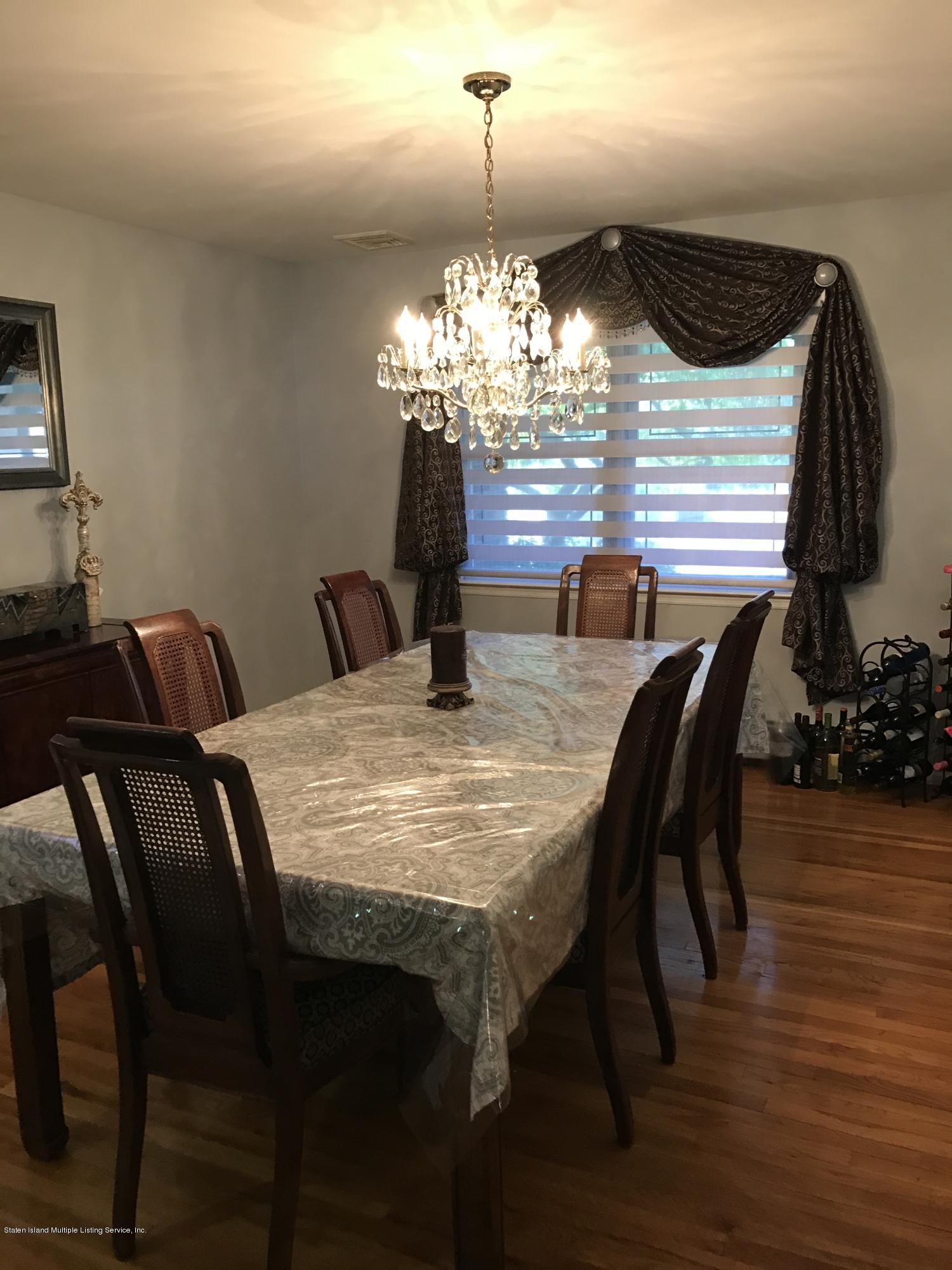 80 Rathbun Avenue Staten Island, NY 10312 - Photo 6 of 21 a dining room with furniture and wooden floor