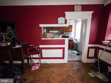 a kitchen with stainless steel appliances granite countertop a stove a sink dishwasher and cabinets with wooden floor