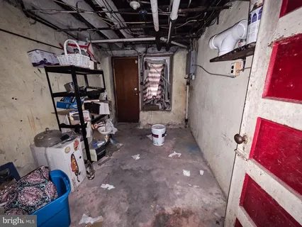 a white toilet sitting next to a bathroom sink and a mirror