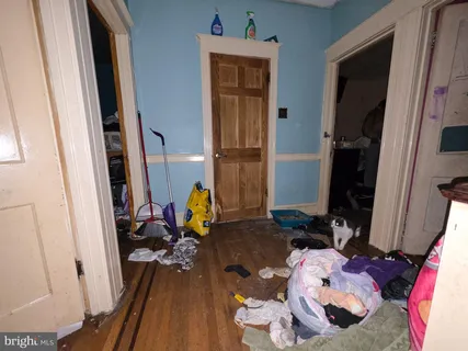 a bedroom with bed and a window