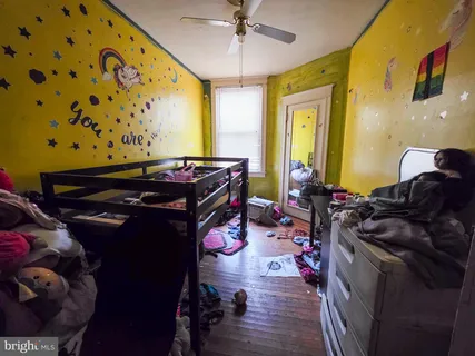 a bed room with a bed and a lamp