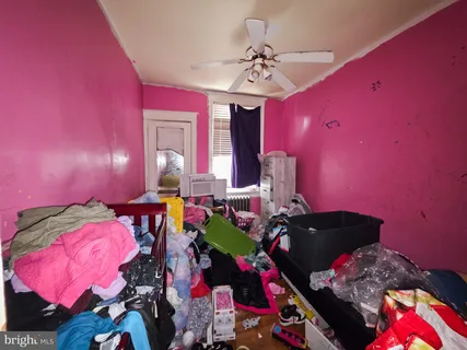 a bedroom with bed and a window