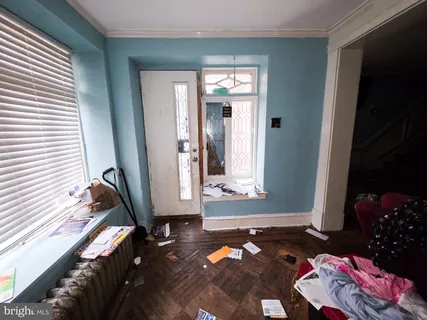 a living room with furniture toys and a window