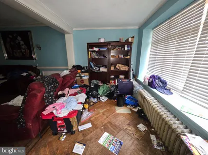 a reading room with furniture and a window