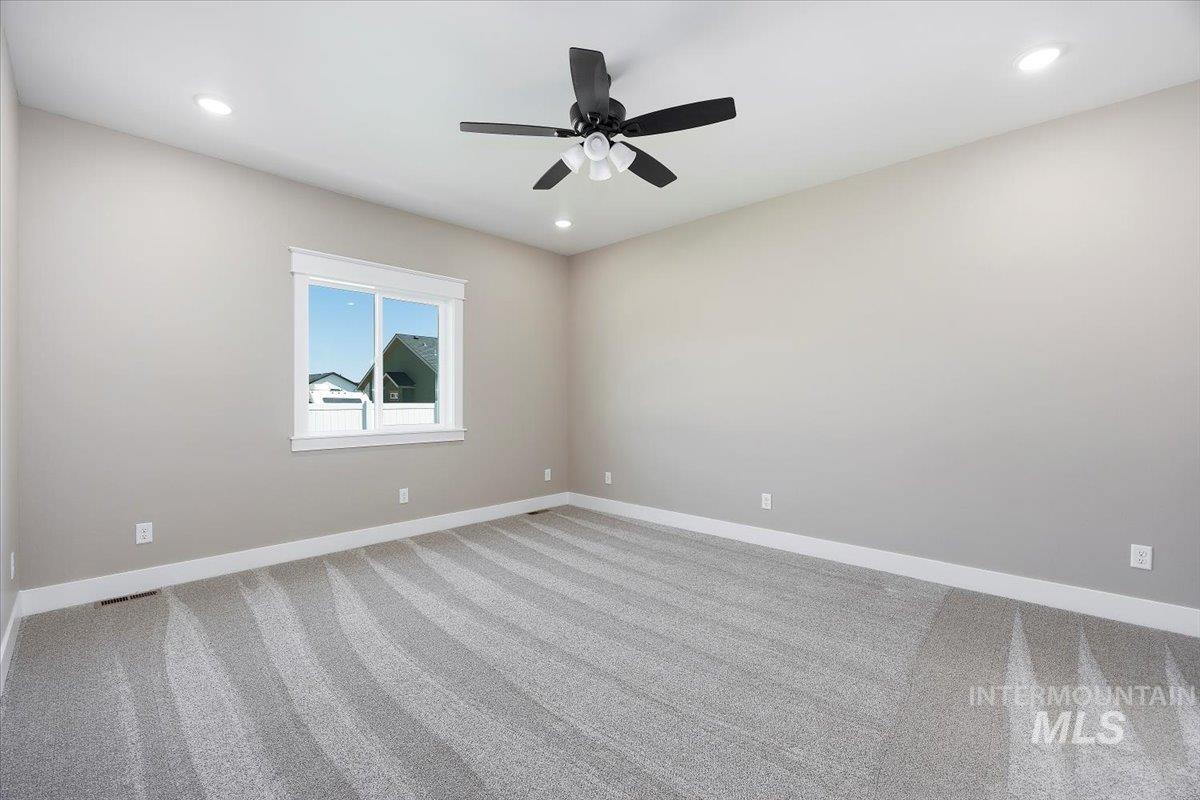 231 Sandi Road Twin Falls, ID 83301 - Photo 13 of 31 Spare room featuring carpet, recessed lighting, and a ceiling fan