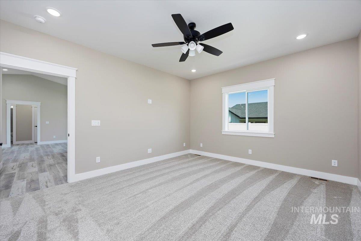 231 Sandi Road Twin Falls, ID 83301 - Photo 16 of 31 Unfurnished room with light carpet, recessed lighting, and a ceiling fan