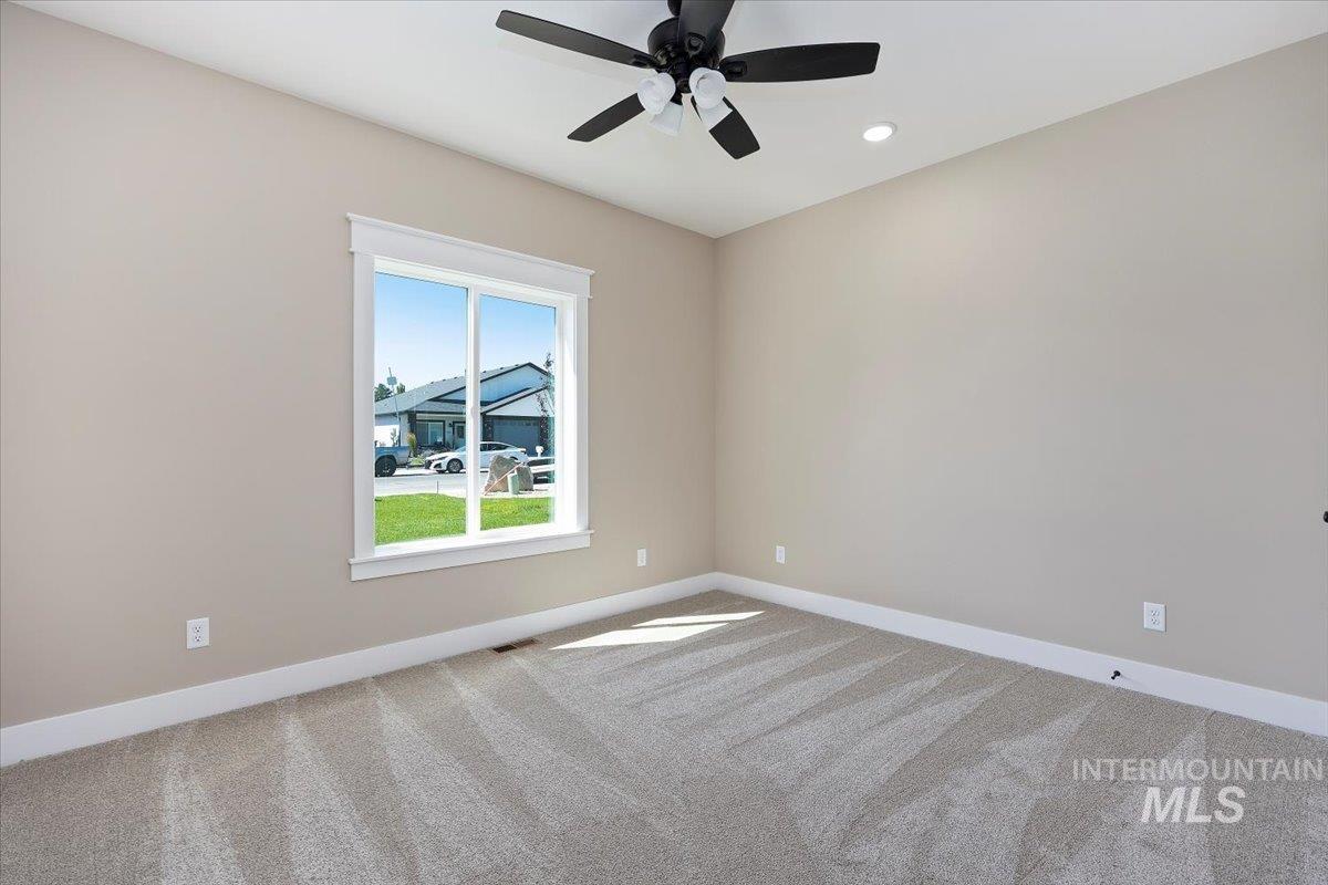 231 Sandi Road Twin Falls, ID 83301 - Photo 21 of 31 Unfurnished room with light colored carpet, recessed lighting, and ceiling fan