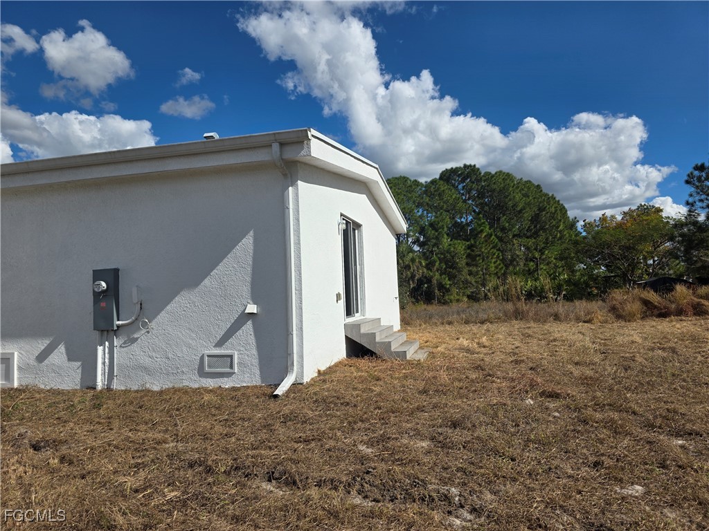 2615 32nd Street Southwest Lehigh Acres, FL 33976 - Photo 3 of 19 a view of a house with a backyard