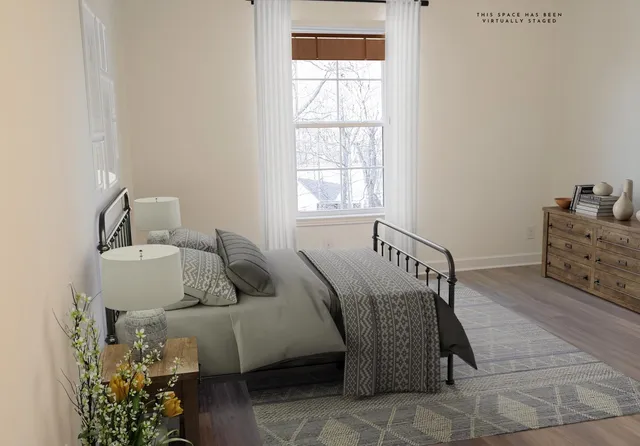 a living room with furniture and flowers