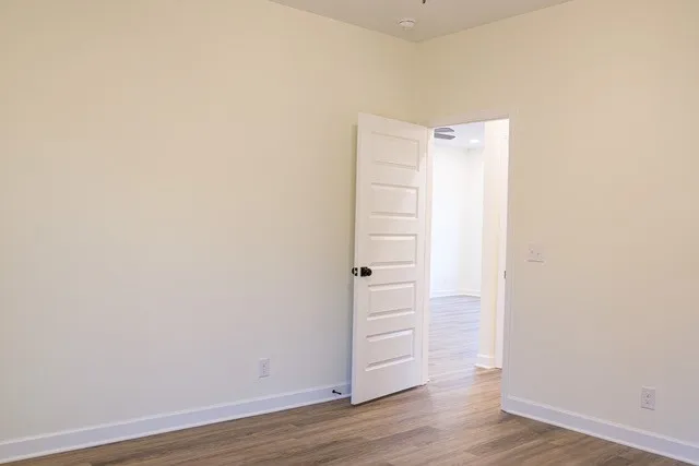 a view of a small space with wooden floor