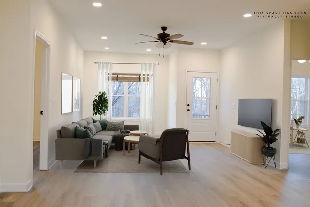 a living room with furniture and a flat screen tv