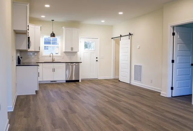 a view of kitchen with wooden floor and window