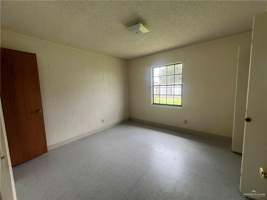 5020 La Homa Road Mission, TX 78574 - Photo 17 of 28 an empty room with a window and a fireplace