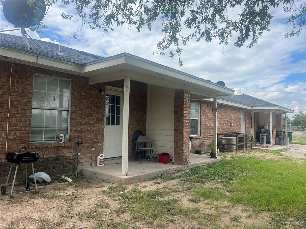 5020 La Homa Road Mission, TX 78574 - Photo 2 of 28 a backyard of a house with table and chairs