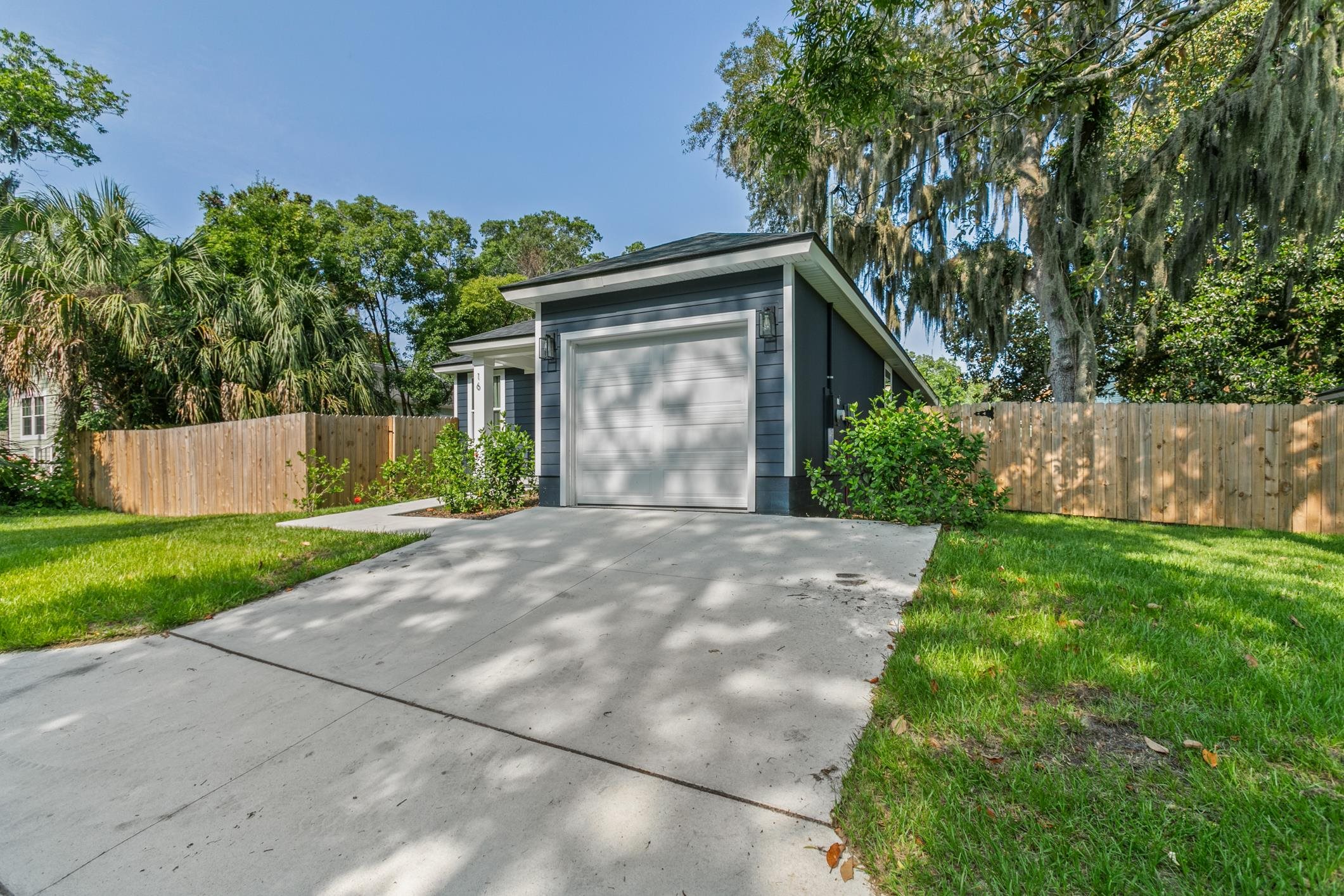 16 Sidney Street St. Augustine, FL 32084 - Photo 4 of 19 a front view of a house with a yard and a garage