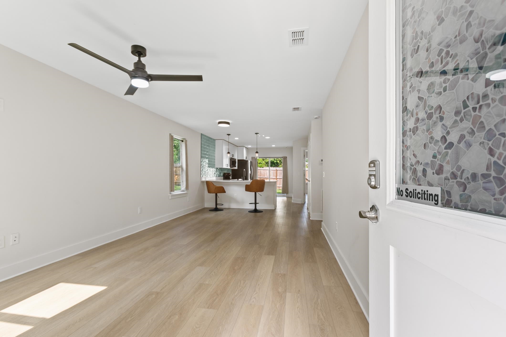 16 Sidney Street St. Augustine, FL 32084 - Photo 6 of 19 a view of a livingroom with wooden floor and a ceiling fan