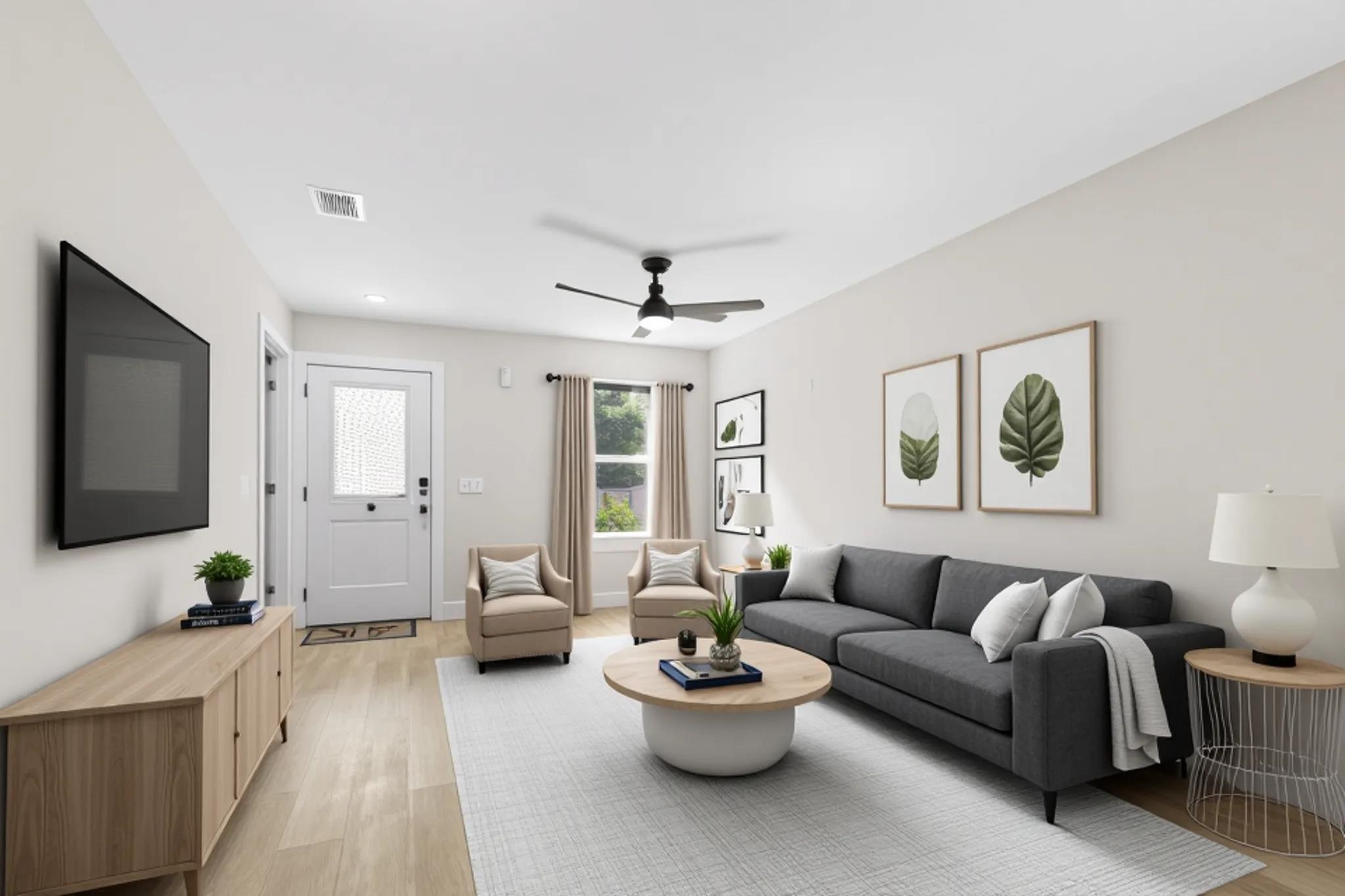 16 Sidney Street St. Augustine, FL 32084 - Photo 8 of 19 a living room with furniture and a flat screen tv