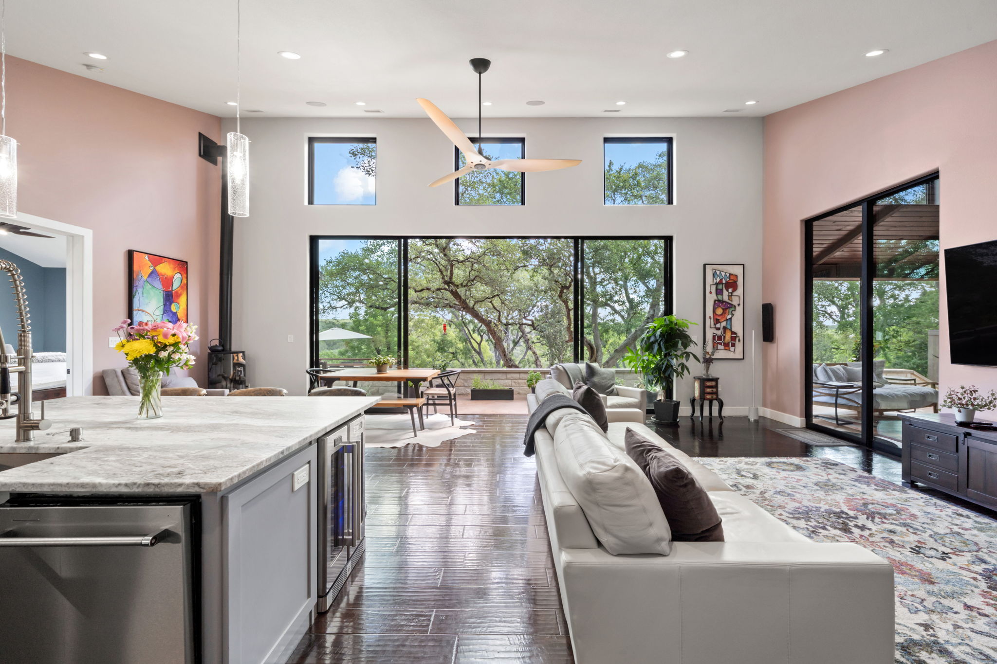 172 Bluff Trail Dripping Springs, TX 78620 - Photo 23 of 40 Living room with a high ceiling, wine cooler, ceiling fan, dark wood-style floors, and recessed lighting