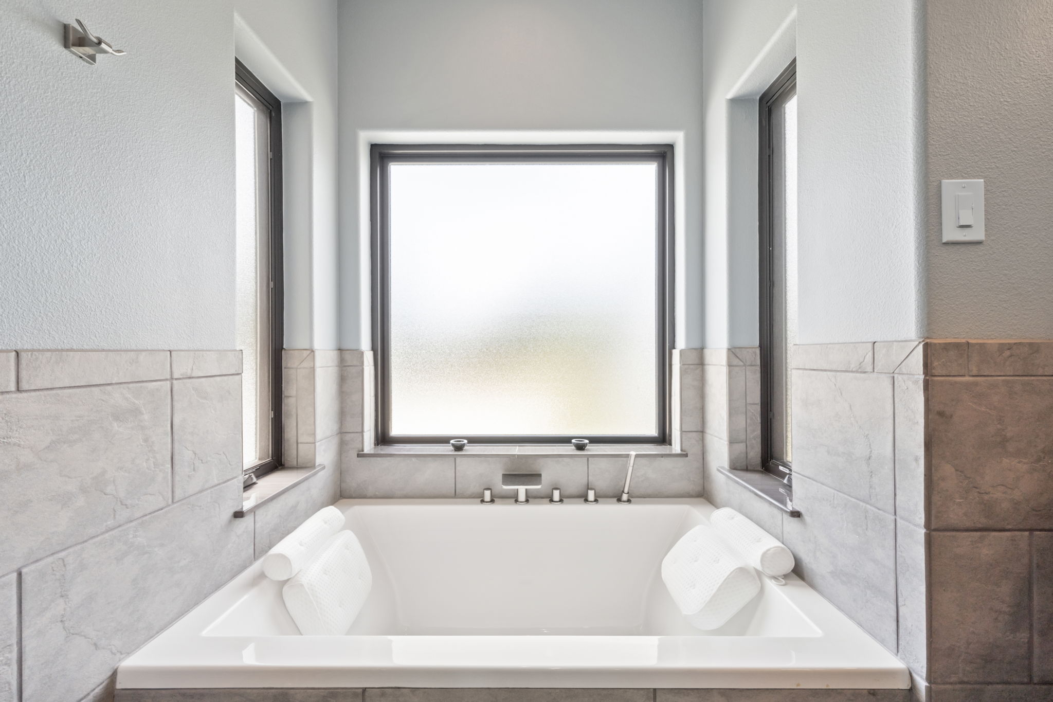 172 Bluff Trail Dripping Springs, TX 78620 - Photo 30 of 40 a bath tub sitting in a bathroom next to a window