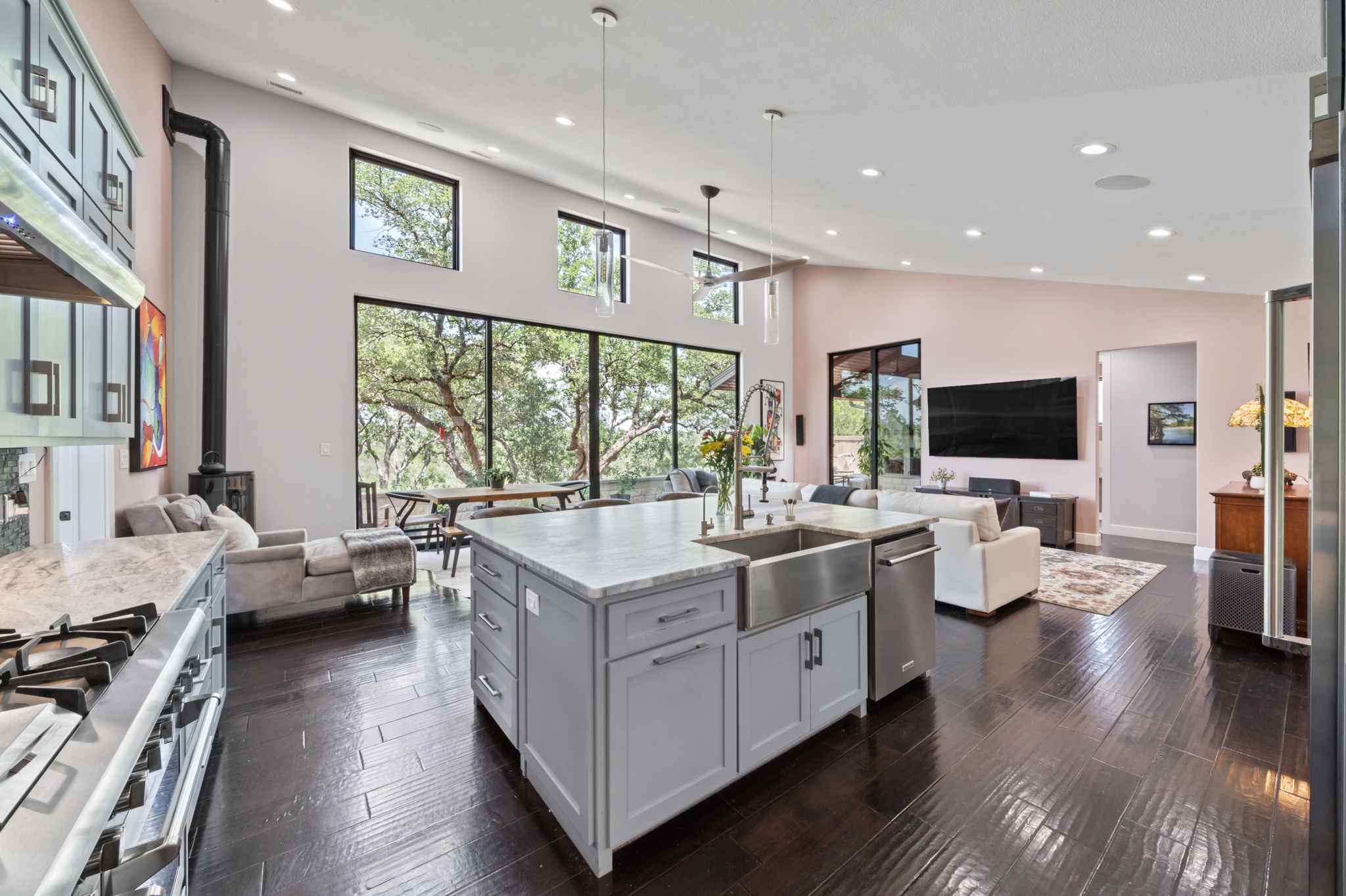 172 Bluff Trail Dripping Springs, TX 78620 - Photo 8 of 40 a living room with furniture wooden floor and a flat screen tv