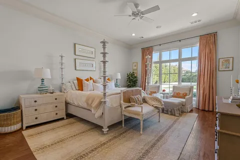 a bed room with furniture and a large window