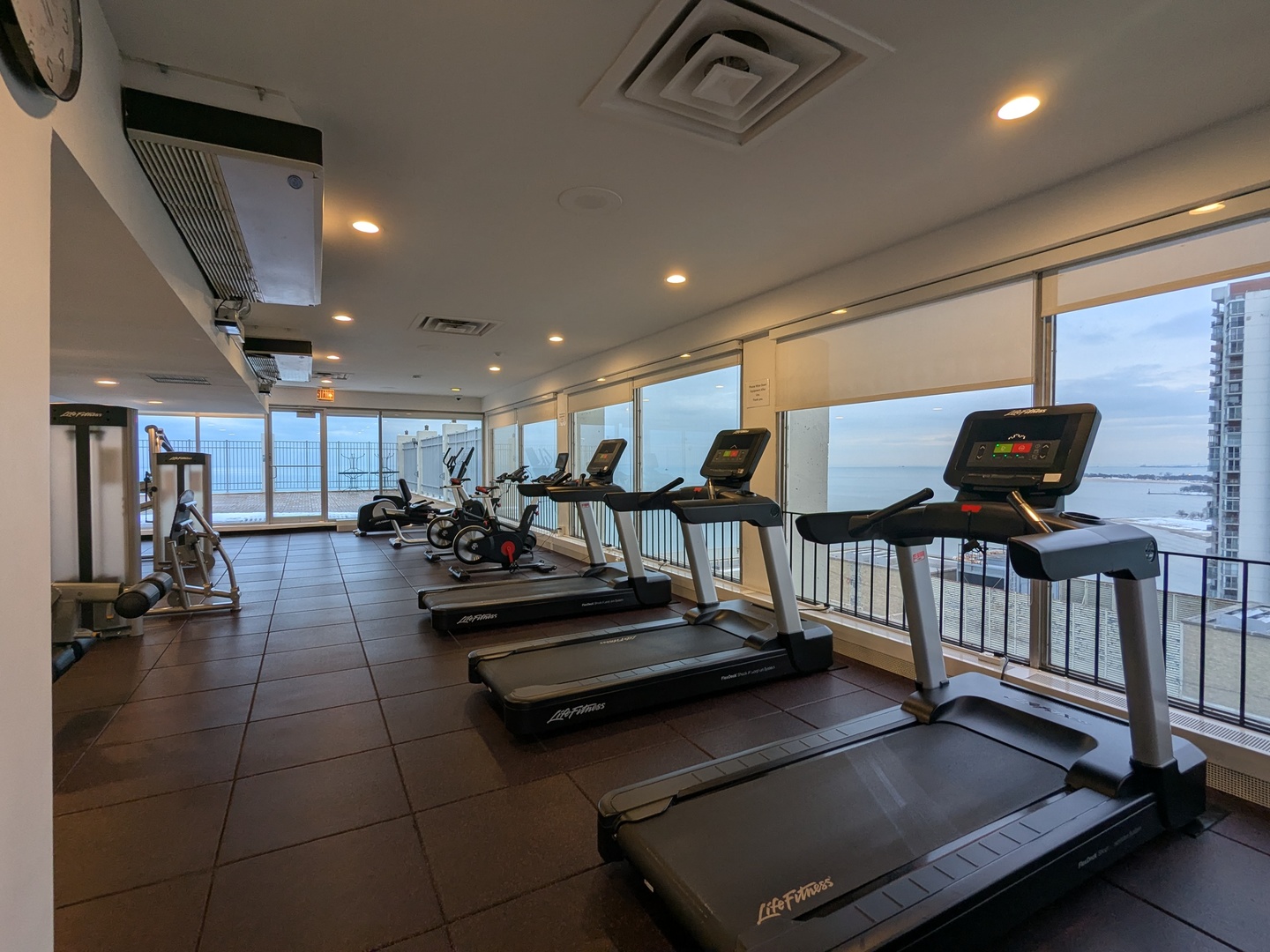 6171 North Sheridan Road, Unit 1408 Chicago, IL 60660 - Photo 20 of 24 a living room with lots of furniture and air hockey table