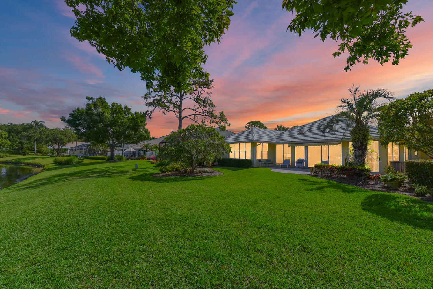 3510 Southeast Cambridge Drive Stuart, FL 34997 - Photo 13 of 54 a view of a house with backyard and garden