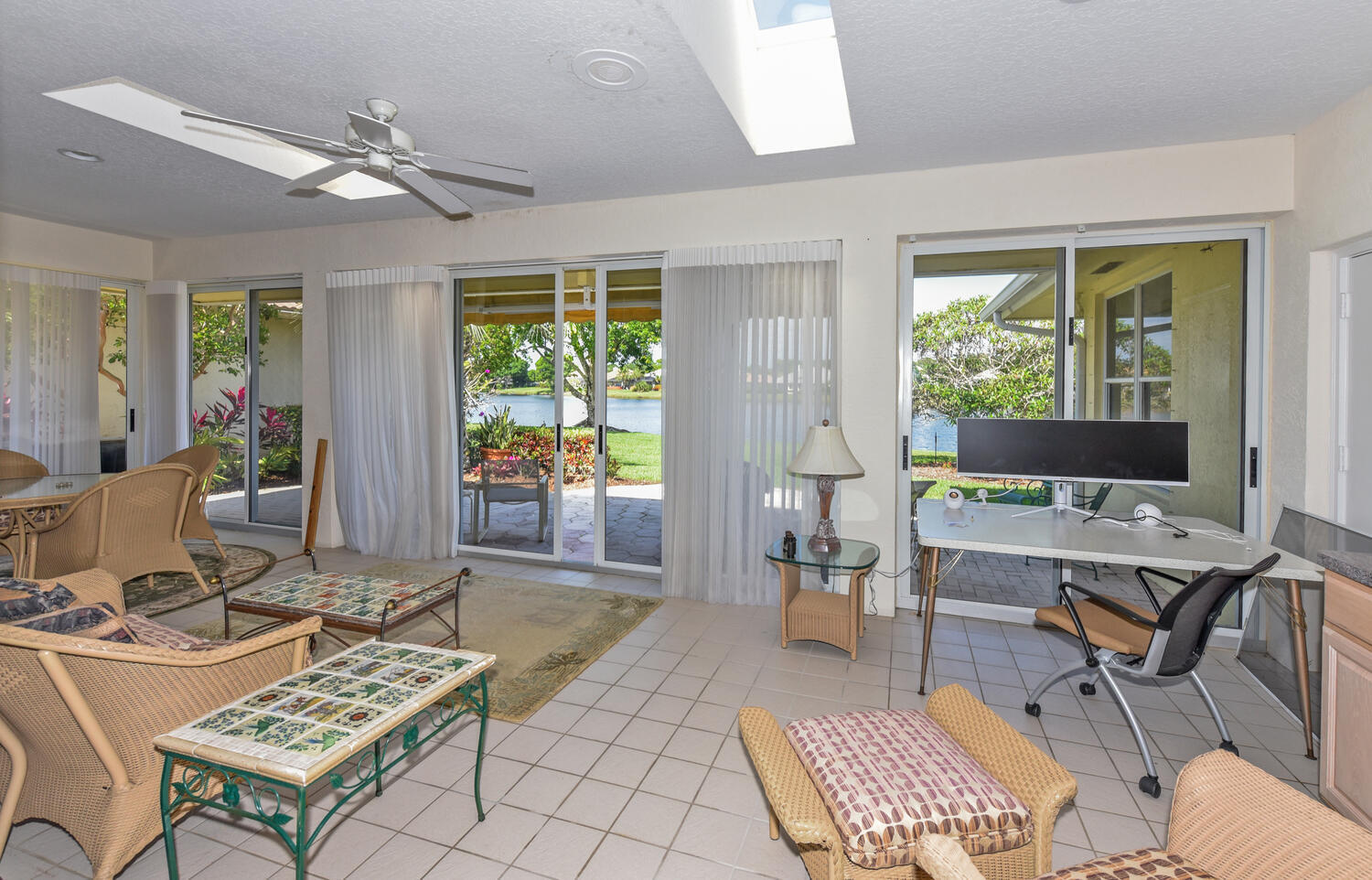 3510 Southeast Cambridge Drive Stuart, FL 34997 - Photo 23 of 54 a workspace with furniture and a rug