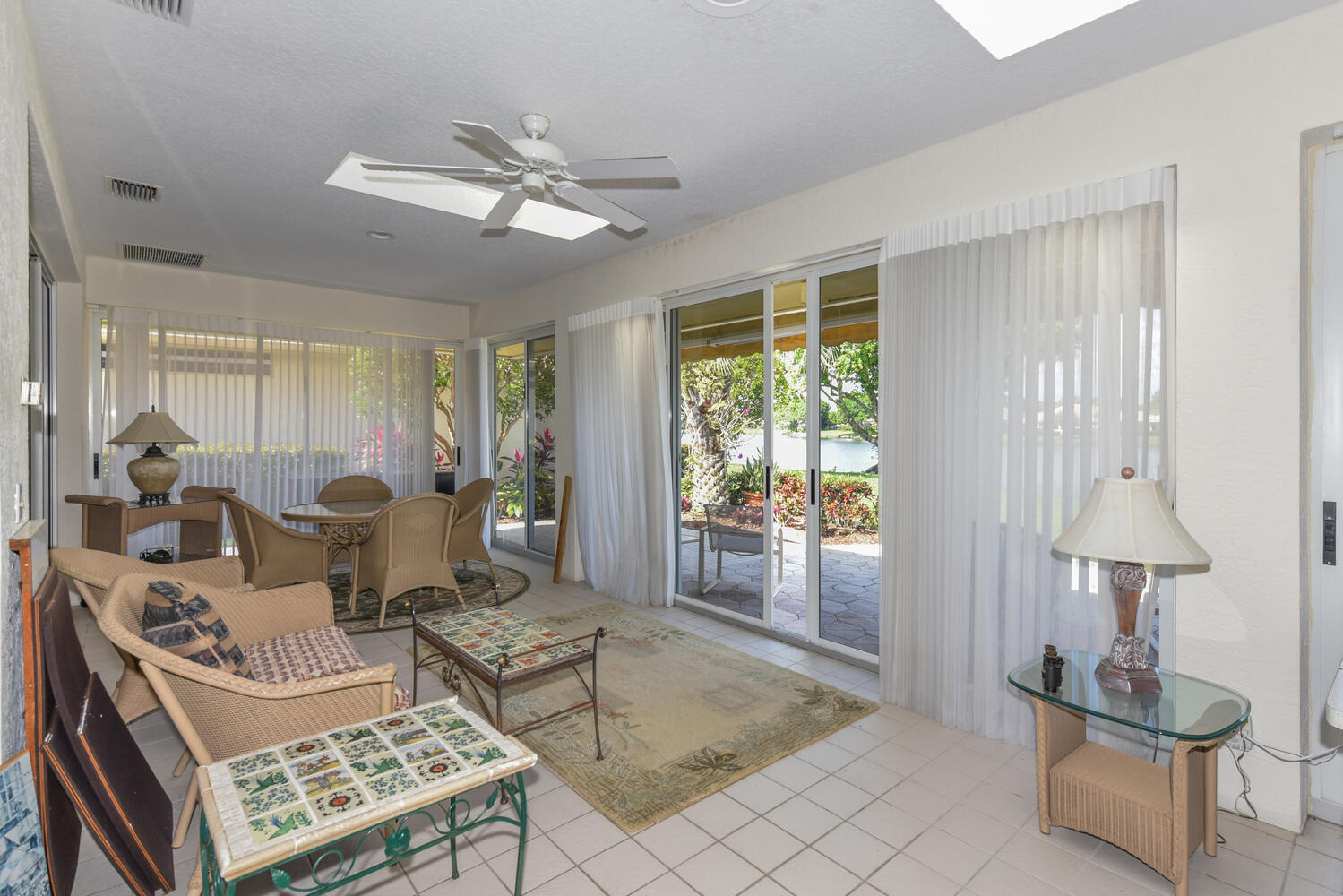3510 Southeast Cambridge Drive Stuart, FL 34997 - Photo 24 of 54 a living room with furniture and a window