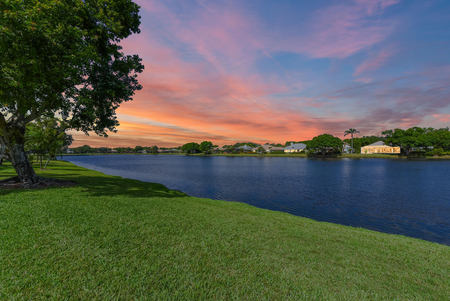 3510 Southeast Cambridge Drive Stuart, FL 34997 - Photo 26 of 54 a view of a lake with houses in the back