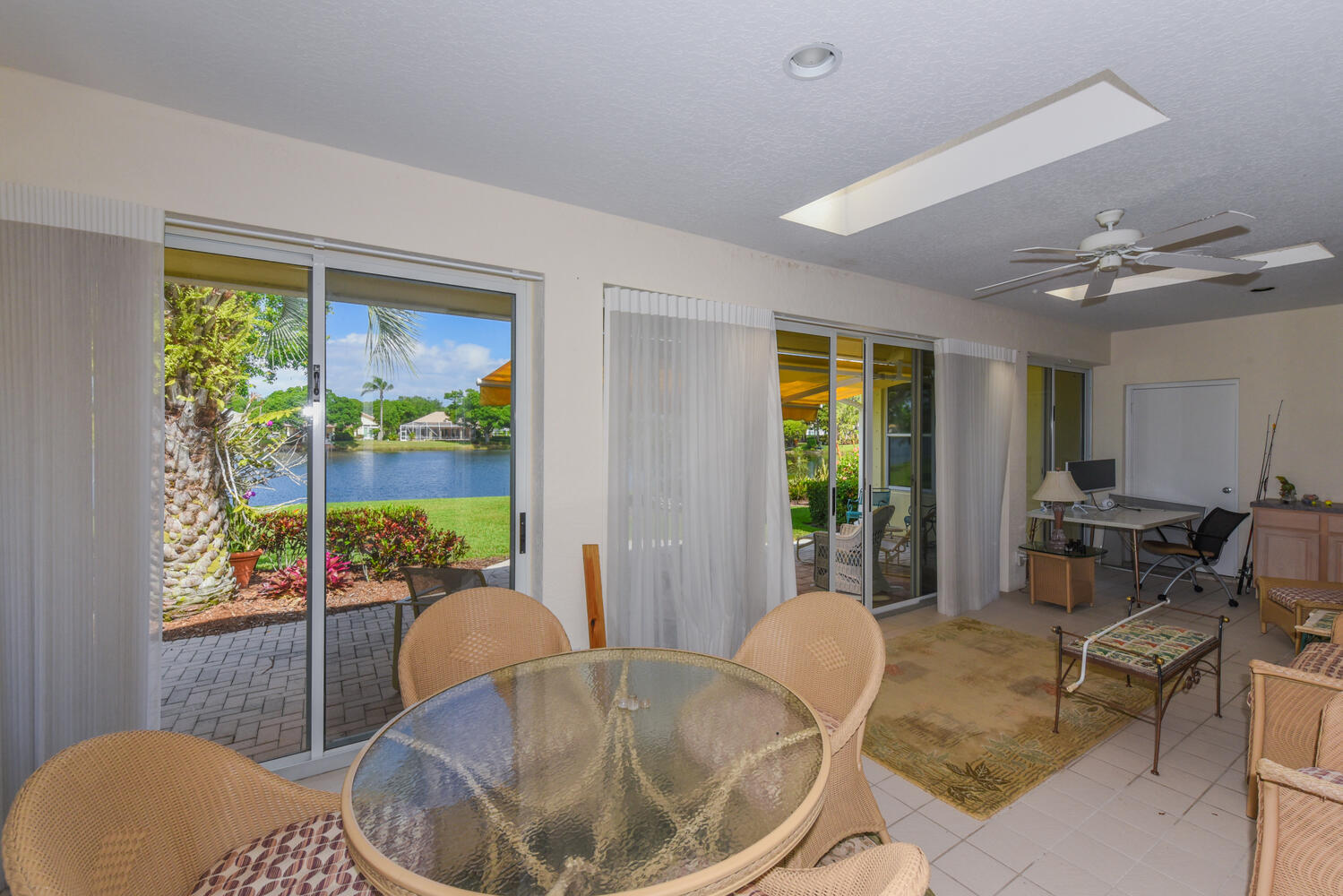 3510 Southeast Cambridge Drive Stuart, FL 34997 - Photo 27 of 54 a living room with furniture and a window