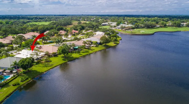 a view of a lake with houses in the back