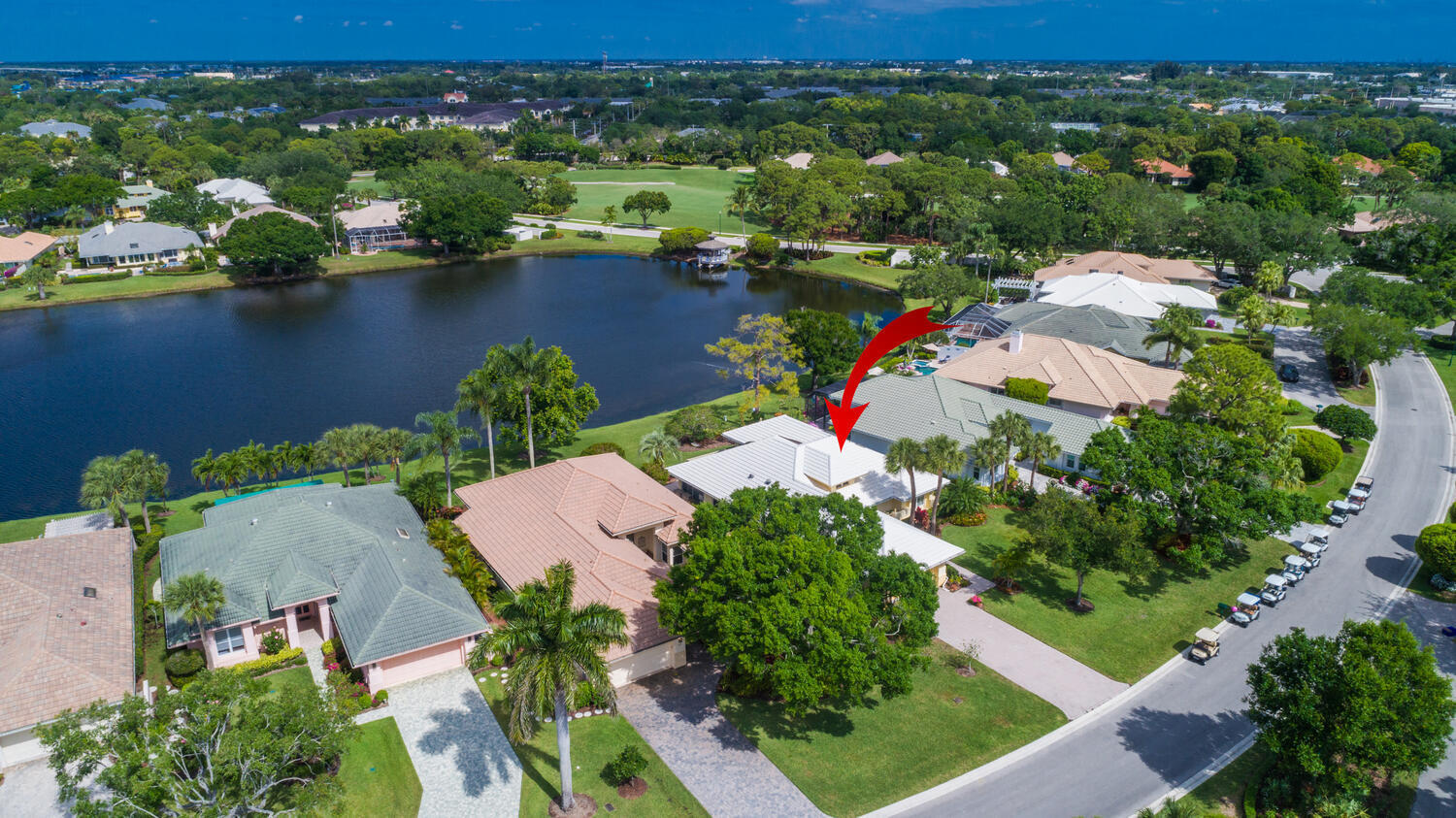 3510 Southeast Cambridge Drive Stuart, FL 34997 - Photo 37 of 54 an aerial view of lake residential house with outdoor space