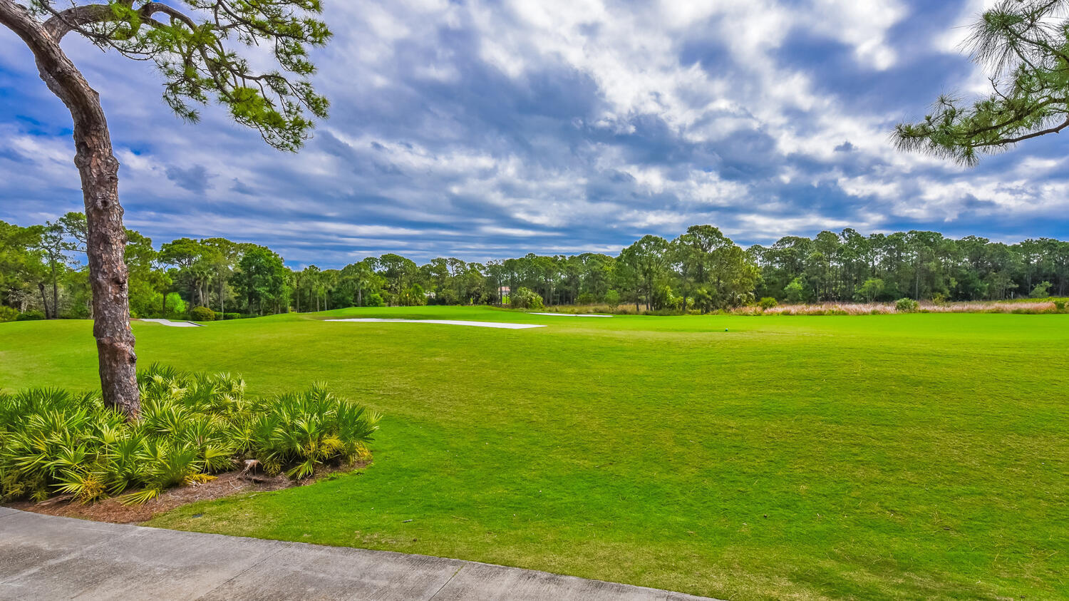 3510 Southeast Cambridge Drive Stuart, FL 34997 - Photo 42 of 54 a view of a golf course with a garden