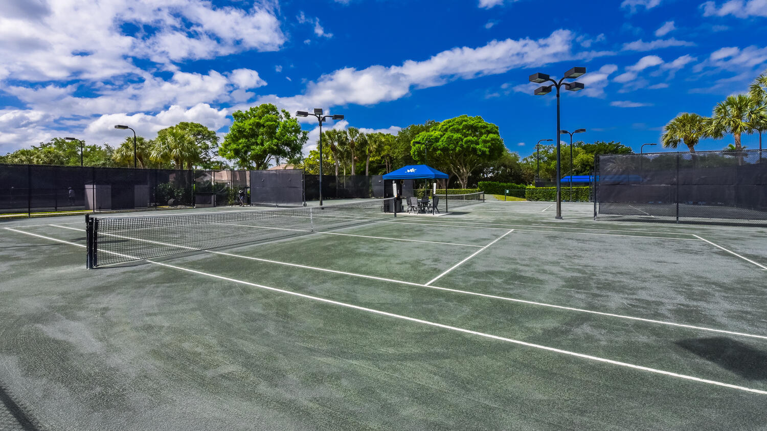 3510 Southeast Cambridge Drive Stuart, FL 34997 - Photo 45 of 54 a view of a tennis court