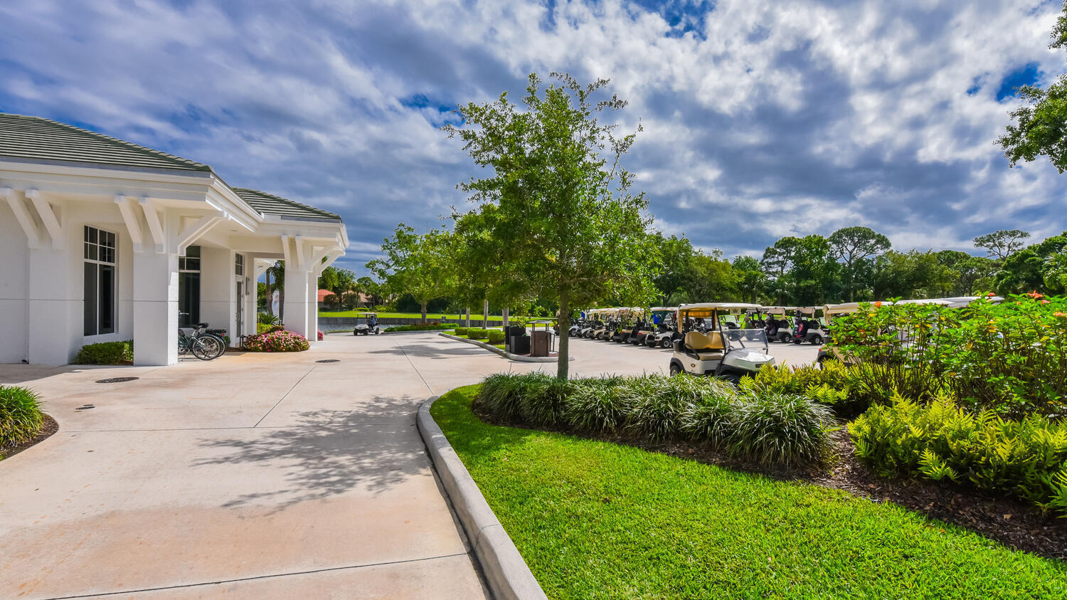 3510 Southeast Cambridge Drive Stuart, FL 34997 - Photo 46 of 54 a view of a garden with a bench