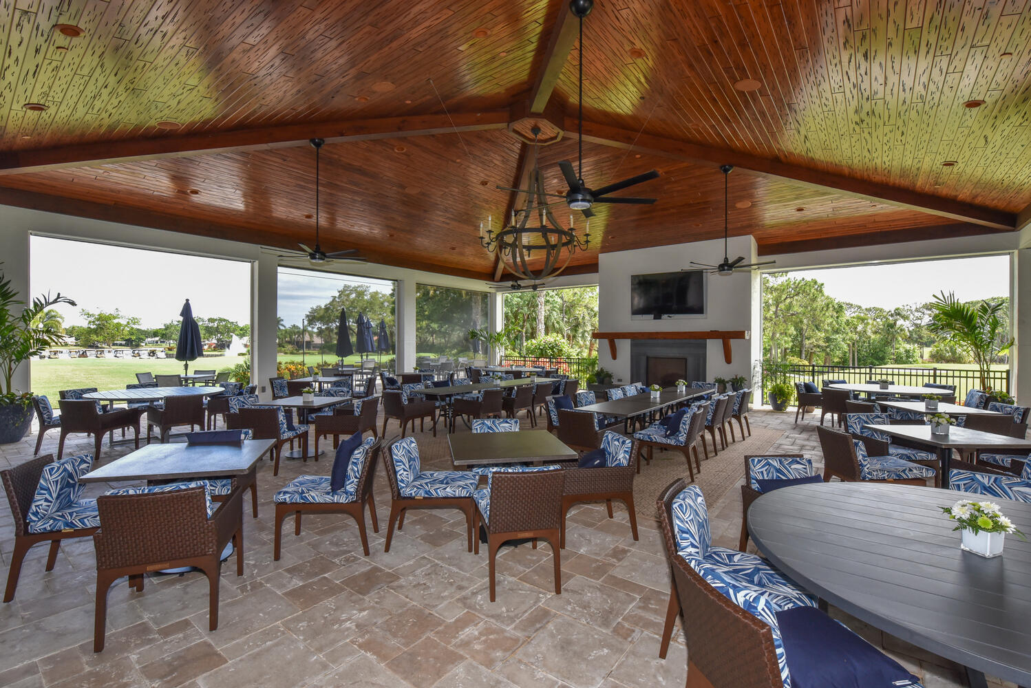 3510 Southeast Cambridge Drive Stuart, FL 34997 - Photo 49 of 54 a view of a patio with a dining table and chairs