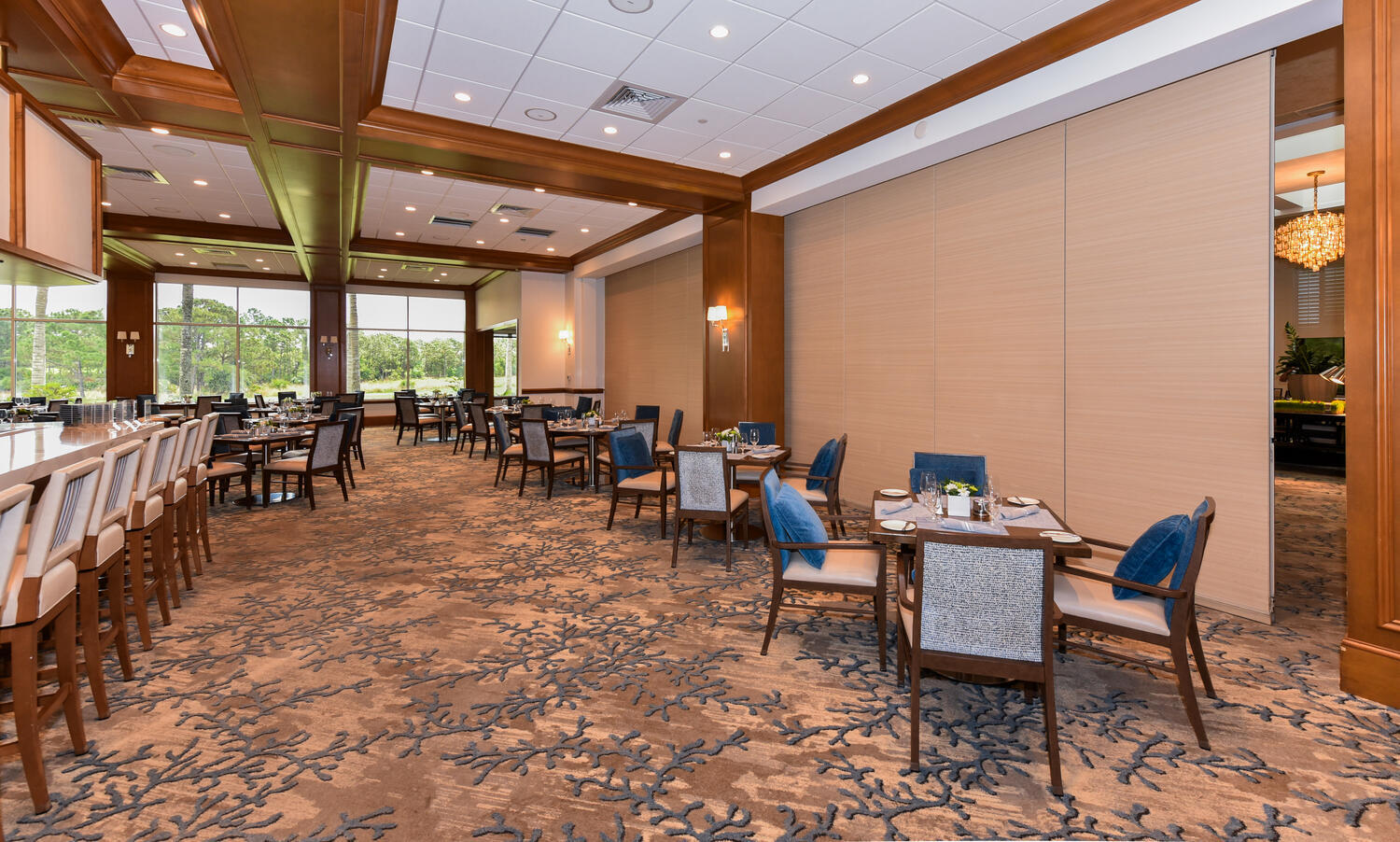 3510 Southeast Cambridge Drive Stuart, FL 34997 - Photo 50 of 54 a outdoor space with lots of tables a large window and chairs