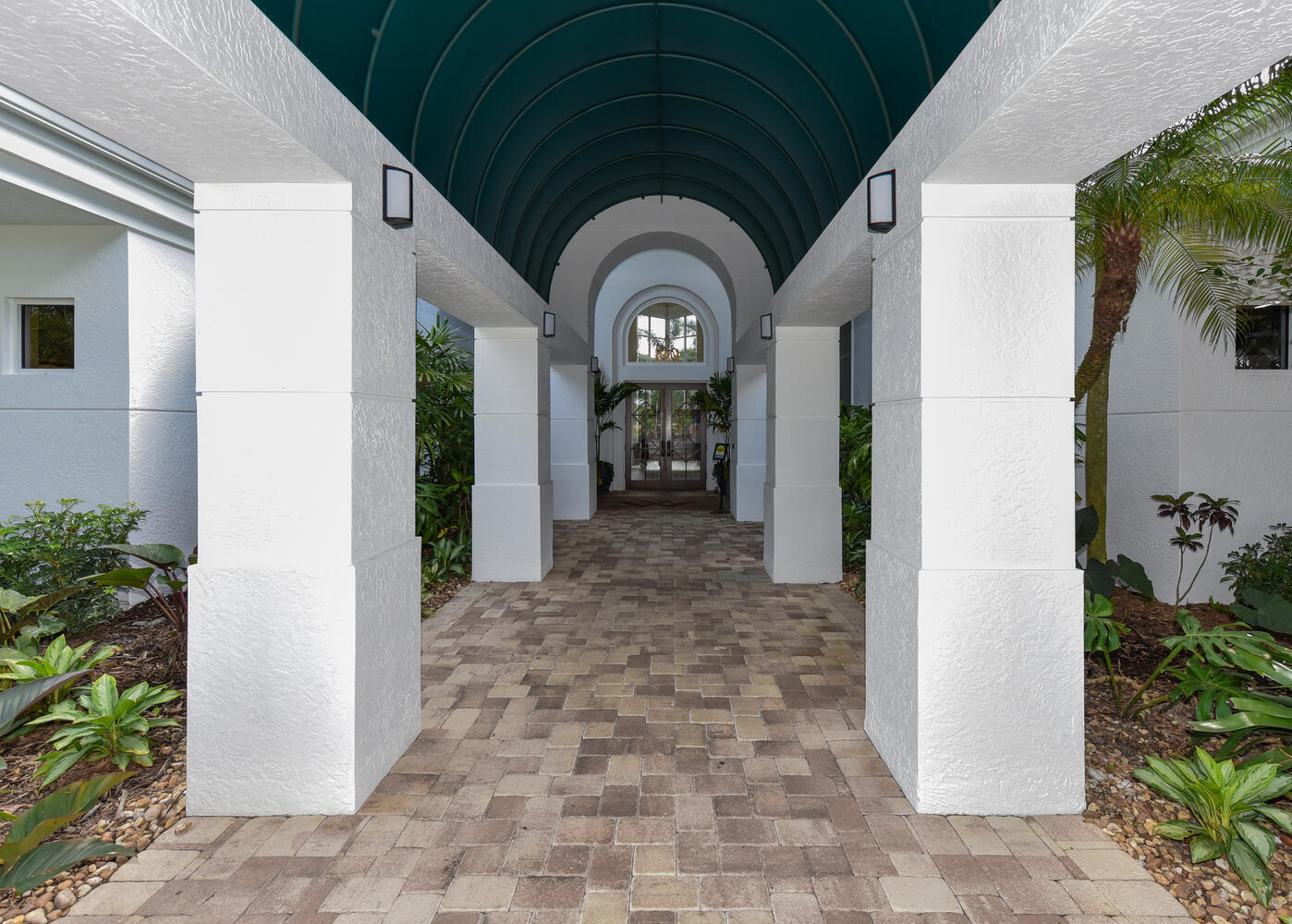 3510 Southeast Cambridge Drive Stuart, FL 34997 - Photo 51 of 54 a view of a entryway door front of house