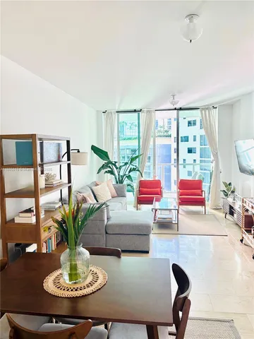 a view of a living room and windows