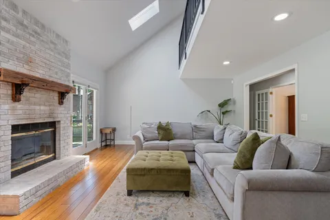 a kitchen with stainless steel appliances granite countertop a stove a sink dishwasher and a refrigerator