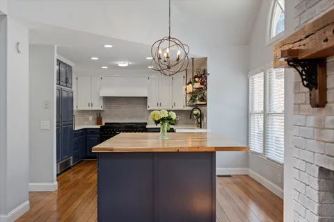a kitchen with stainless steel appliances granite countertop a sink and cabinets
