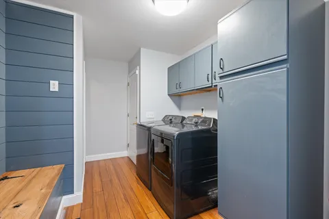 a bed room with a bed and a potted plant