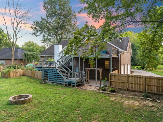 an aerial view of a house with yard and outdoor space