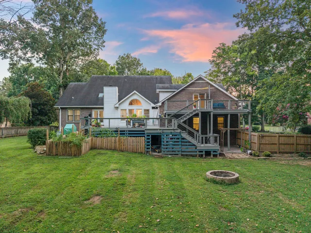 a view of a street with a houses in the background