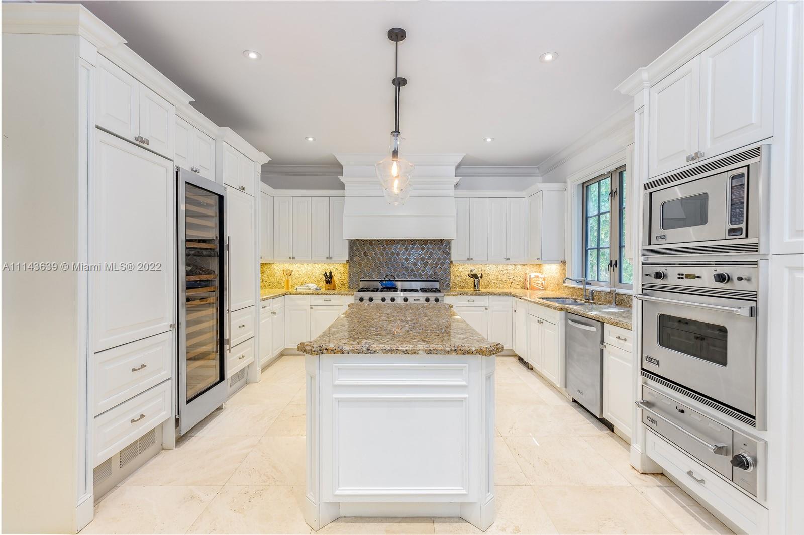 8230 Southwest 53rd Avenue Miami, FL 33143 - Photo 11 of 34 a kitchen with stainless steel appliances granite countertop a stove and cabinets