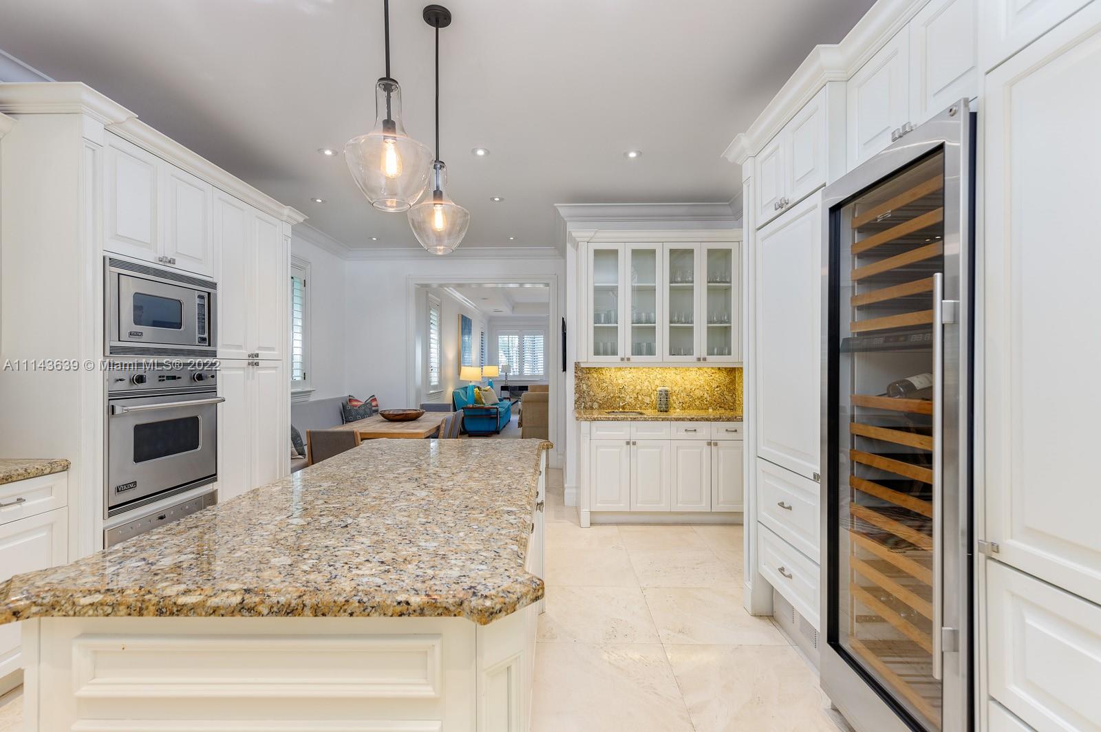 8230 Southwest 53rd Avenue Miami, FL 33143 - Photo 12 of 34 a kitchen with a stove a sink and a refrigerator
