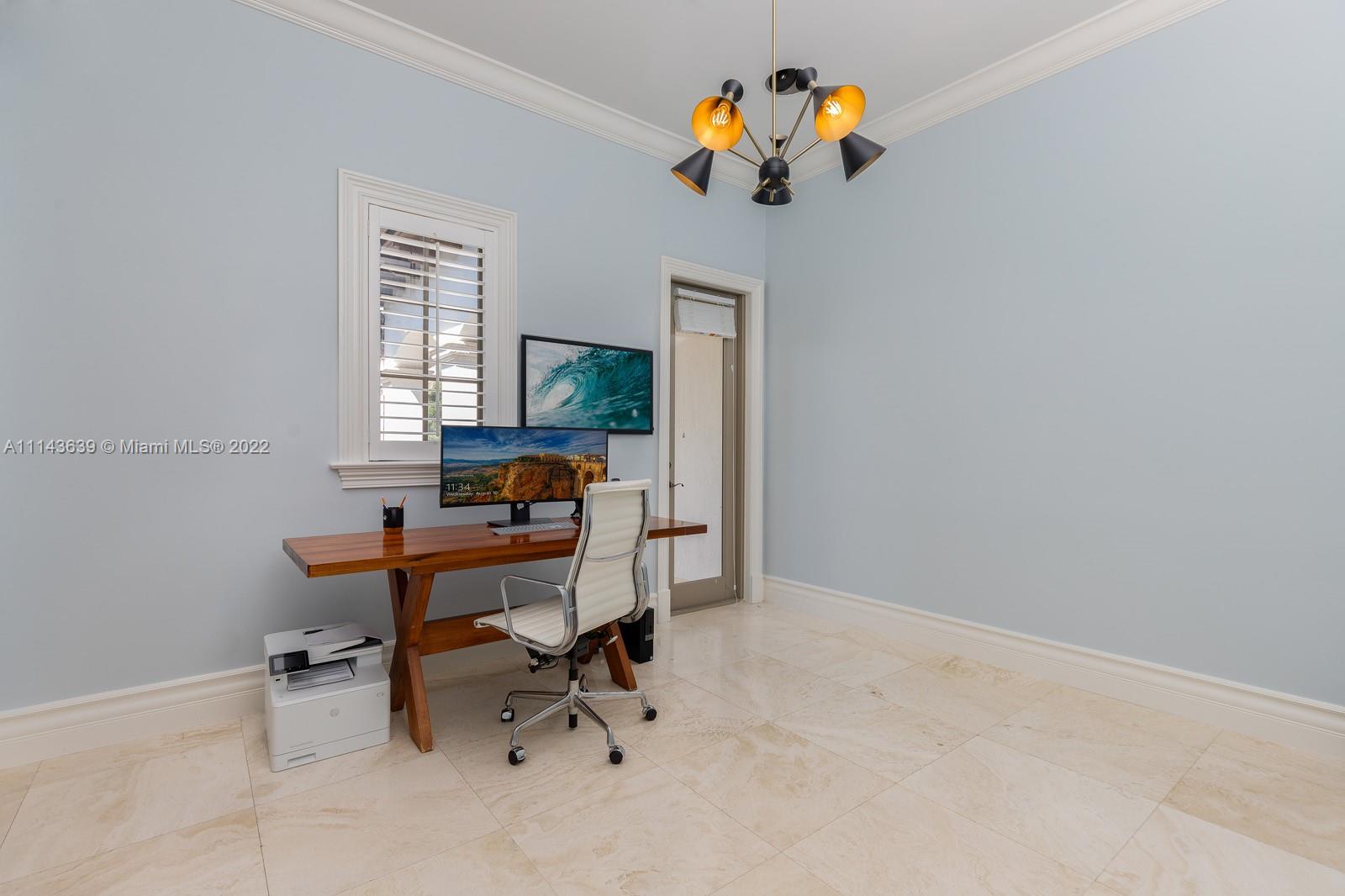 8230 Southwest 53rd Avenue Miami, FL 33143 - Photo 14 of 34 a view of a workspace with furniture and a window